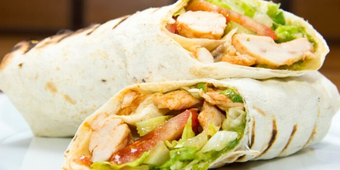 Two grilled chicken wraps with lettuce and tomato at Fifth Avenue Taphouse New Brighton.