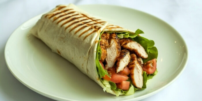 A grilled chicken wrap with lettuce and tomato at Fifth Avenue Taphouse New Brighton.