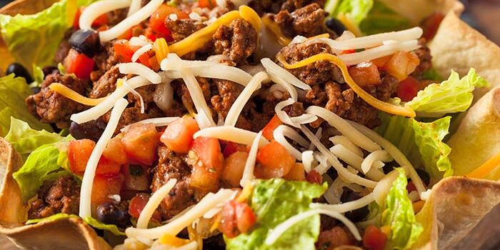 Taco salad with ground beef, lettuce, cheese, and tomatoes at Fifth Avenue Taphouse New Brighton.
